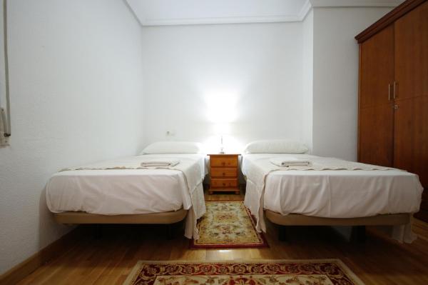 Cama o camas de una habitación en Livingtarifa Apartament El Atún