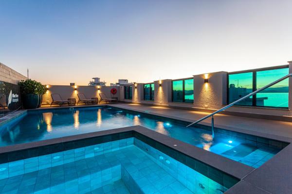 a swimming pool on the roof of a building at Blue Tree Premium Florianópolis in Florianópolis