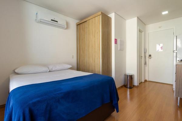 Cama o camas de una habitación en Vivapp Universo Augusta Residencial