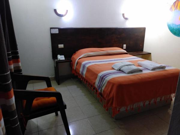Cama o camas de una habitación en Casa Nucú Hotel