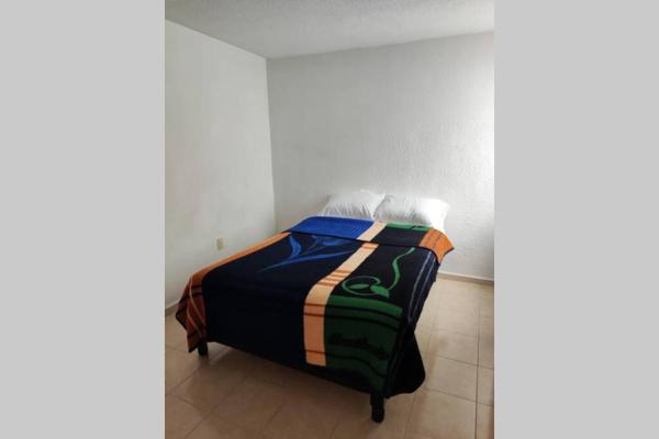 Cama o camas de una habitación en Casa de las Orquideas 2C 1B Jorge R Lugo