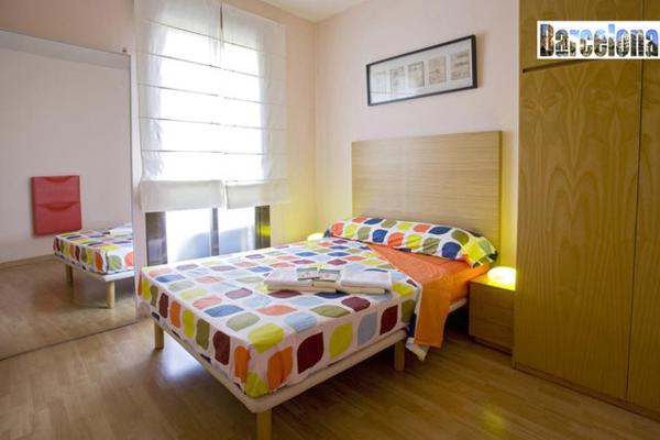Cama o camas de una habitación en Barcelona Centric Apartment