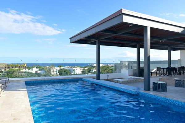 Piscina o búsqueda de Brand New & Lovely 1BR Apartment PDC Rooftop Pool, Gimnasio y Pool Table Buenas comodidades
