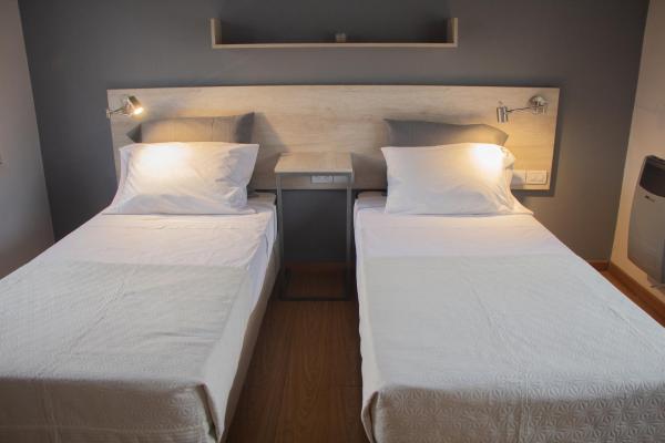 Una cama o camas en una habitación de LA AMISTAD-CIUDAD UNIVERSITARIA- HOSPITAL FERREYRA
