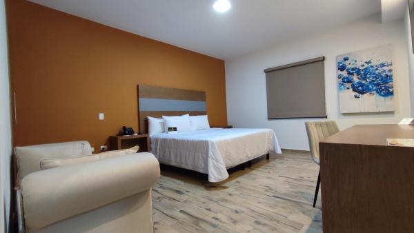 Cama o camas de una habitación en Hotel Andalucía