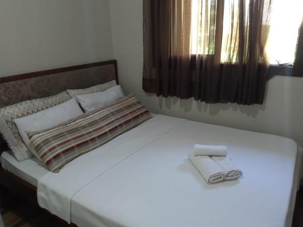 Cama o camas de una habitación en Residenciais Maria Flor