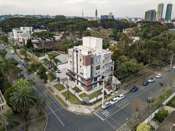 an aerial view of a white building on a city street at Zen Space in Curitiba