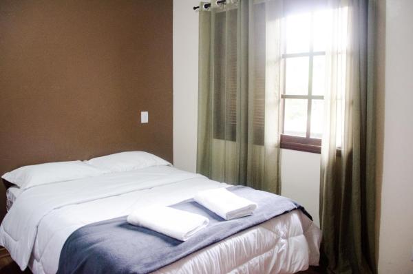 Cama o camas de una habitación en Residencial Belo Centro Gramado