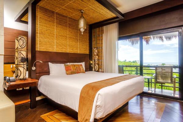 Cama o camas de una habitación en Aldea Thai by Stella Rentals