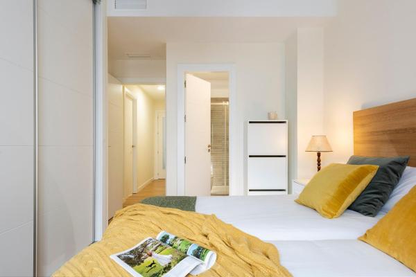 Cama o camas de una habitación en Deluxe Astoria Triana II Acogedor y Tranquilo