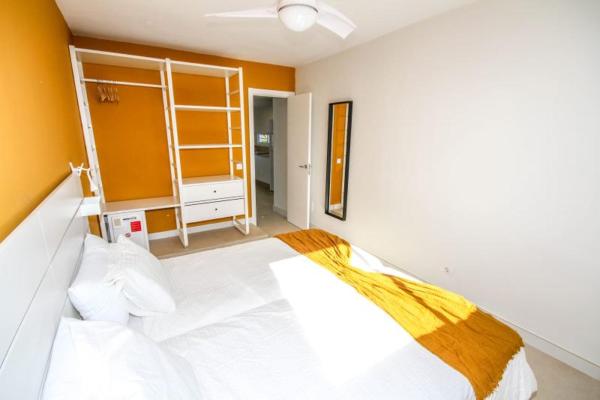 Cama o camas de una habitación en New Miami Playa Apartamentos