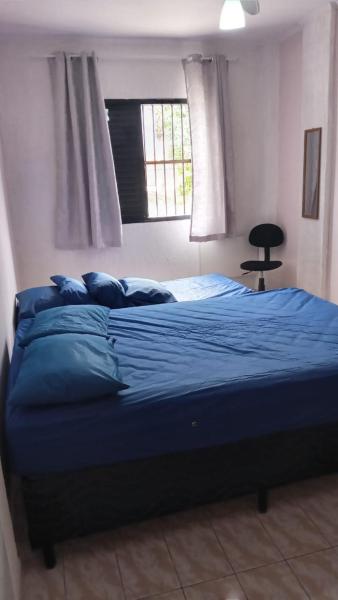 Cama o camas de una habitación en Apartamento com Internet e garagem FREE ! PRAIA GRANDE