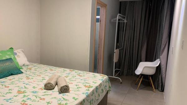 Cama o camas de una habitación en Camboriú á 15 minutos de carro da praia