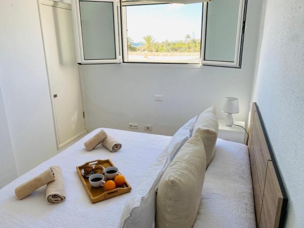 Cama o camas de una habitación en Nueva Suecia San Agustin