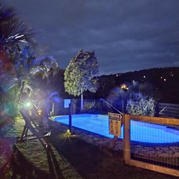 A view of the pool at Pousada Dos Soles or nearby