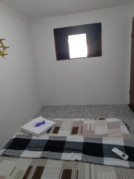 Cama o camas de una habitación en Quarto Aconchego