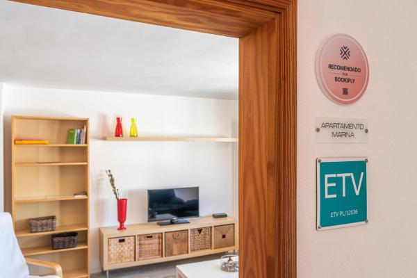 Una televisión o centro de entretenimiento en Piso Ca Na Marina