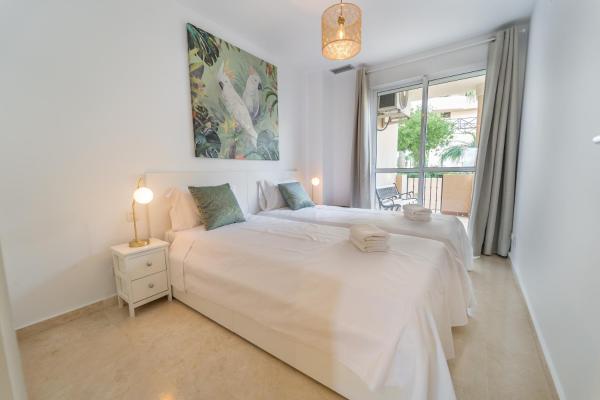 Cama o camas de una habitación en Bonito apartamento entre el golf y el mar en Manilva