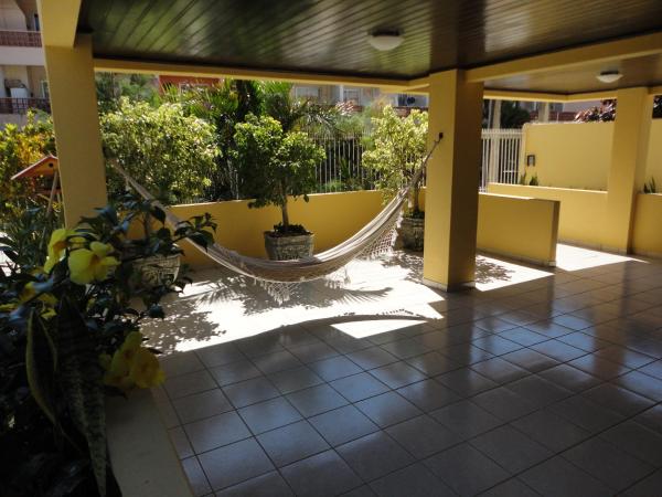 a porch with a hammock and potted plants at Regina del mare apartamento de 02 dormitorios para até 06 pessoas a 50 mts da praia in Florianópolis