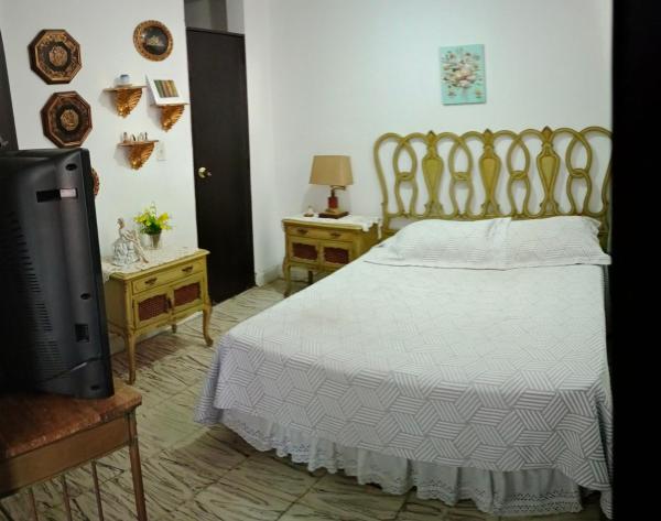 Cama o camas de una habitación en Confortables habitaciones Santa Mónica Residencial