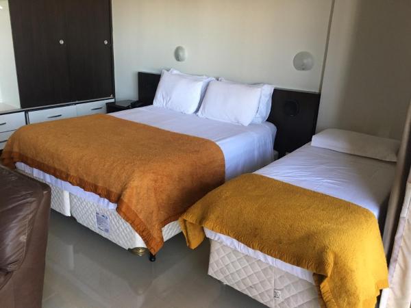 Cama o camas de una habitación en Apart Hotel 123 no Coração de Brasilia Kubitschek Plaza