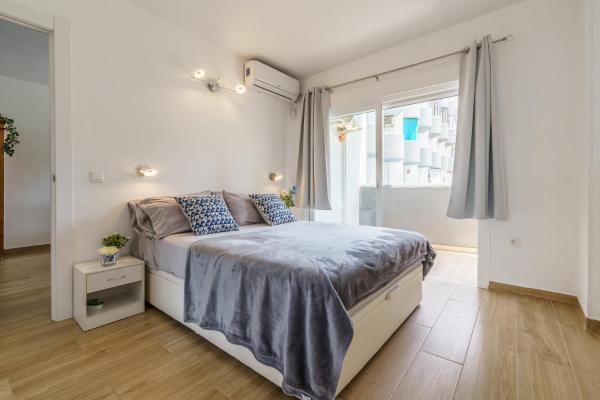 Cama o camas de una habitación en MalagaSuite Comfortable House