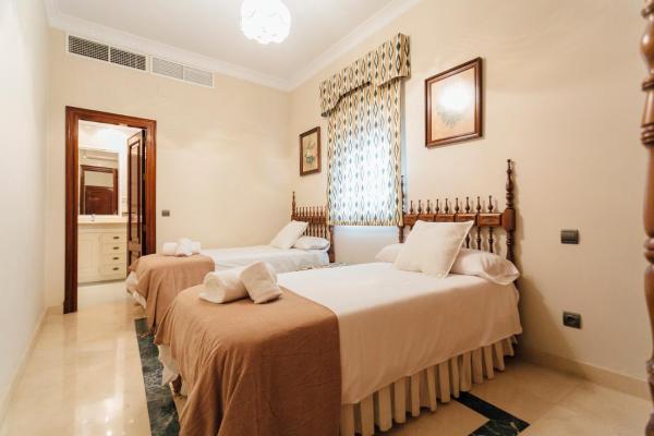 Cama o camas de una habitación en Exclusivo Alojamiento en el centro Sevilla
