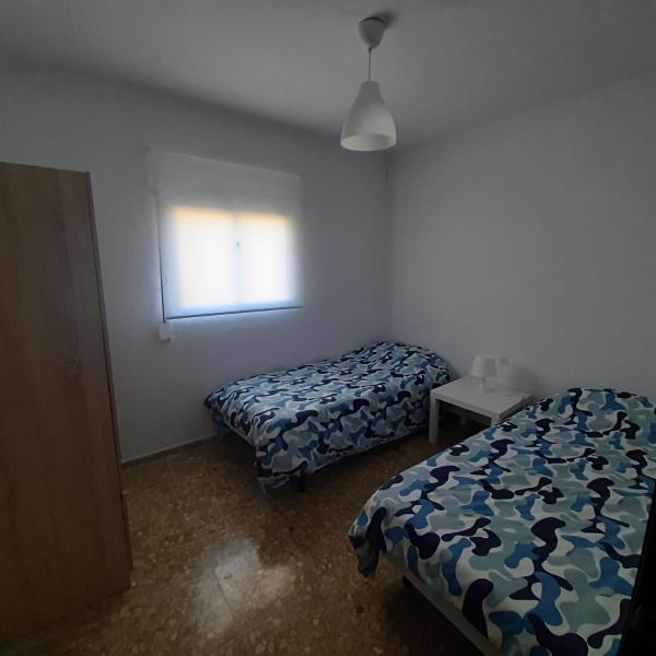 Cama o camas de una habitación en Apartamento turístico en Jerez de la frontera