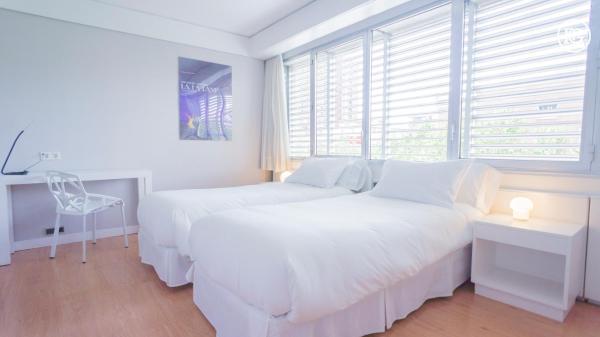 Cama o camas de una habitación en Bernabéu - Cuzco - Eurobuilding 2 Luxury Apartment
