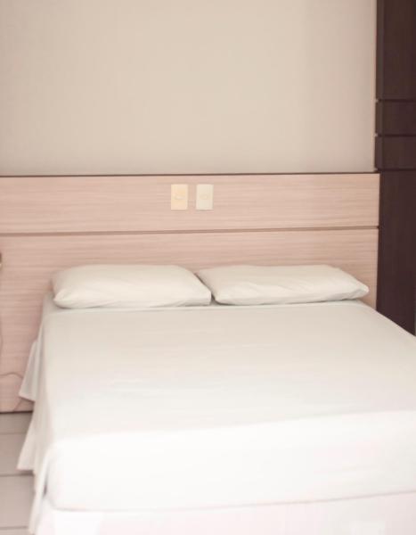 Cama o camas de una habitación en SMART IGUASSU HOTEL