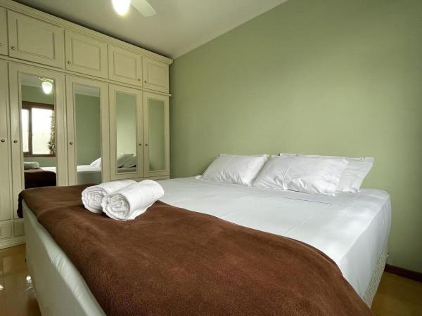 Cama o camas de una habitación en Apartamento no Centro de Gramado com 1 Dormitório