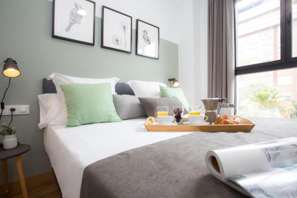 Cama o camas de una habitación en Ruzafa Lander by SingularStays