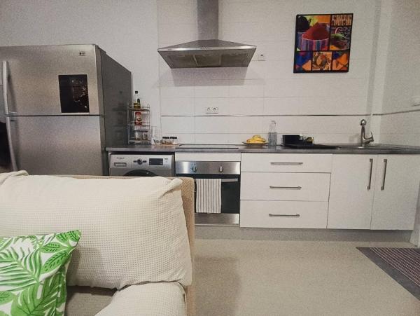 Una cocina o zona de cocina en Céntrico y acogedor apartamento