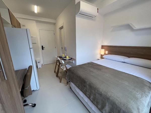 Cama o camas en una habitación en un estudio moderno con Wi-Fi, gimnasio junto al parque de Ibirapuera y metro - ID 09