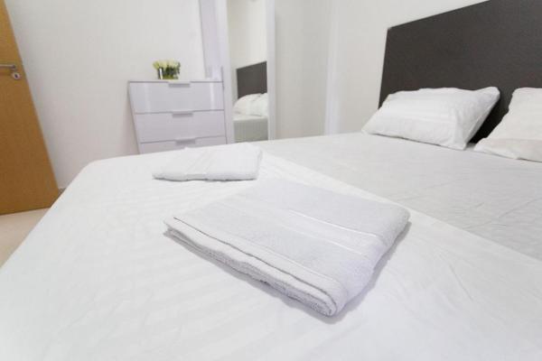 Cama o camas de una habitación en Carpediem - Apartamento com ótima localização em Cabo Branco