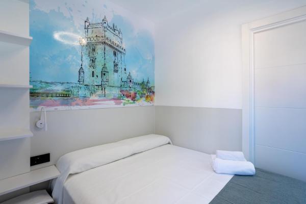 Cama o camas de una habitación en MUNDOBOOKING Centro Levante