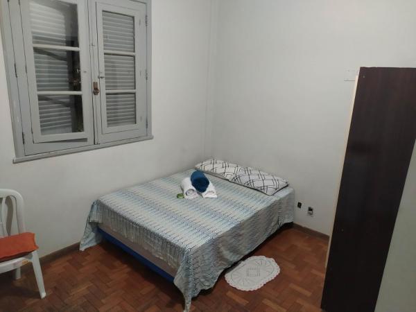 Cama o camas de una habitación en Suíte no centro de BH Rua da Bahia 187