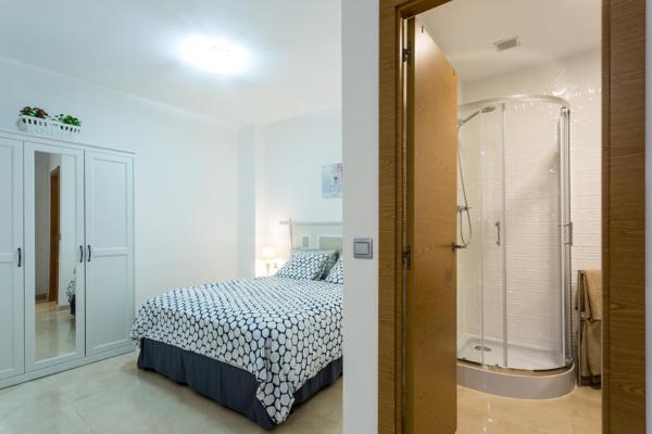 Cama o camas de una habitación en Apartamentos en San Lorenzo