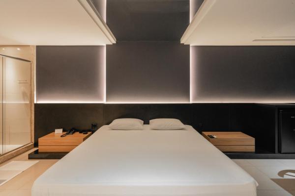 Cama o camas de una habitación en Drops Motel Porto Alegre