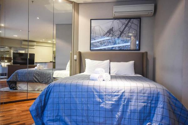 Cama o camas de una habitación en SP Stays Itaim FL Residence