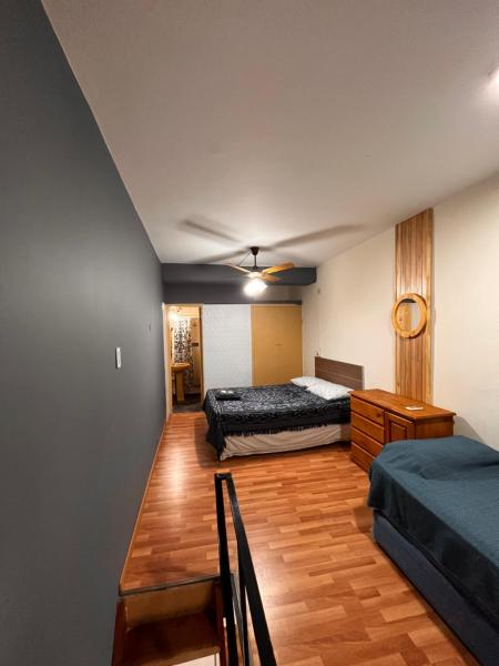 Cama o camas de una habitación en Departamento peatonal villa carlos paz