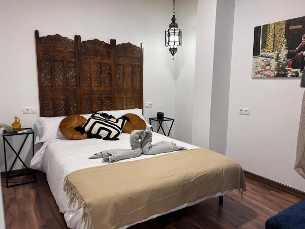 Cama o camas de una habitación en Sueños de la Alhambra