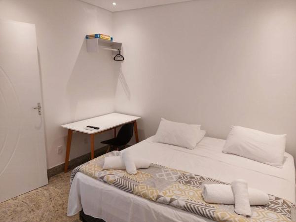Cama o camas en una habitación en Estudio Aconchegante Al lado del metro y Paulista