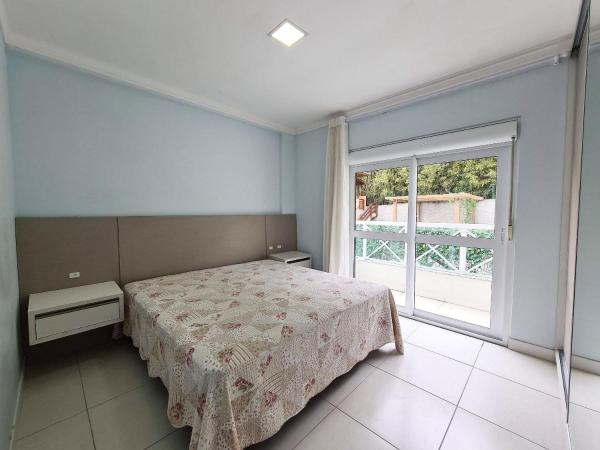 Cama o camas de una habitación en Cobertura Duplex centro de Bombinhas com 03 suites e a poucos metros da Praia de Quatro Ilhas