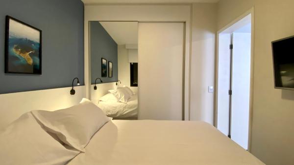 Cama o camas de una habitación en Anora Spaces - Imperial Berrini