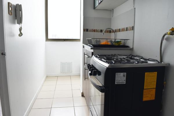 Una cocina o zona de cocina en Precioso departamento ubicado en Santiago