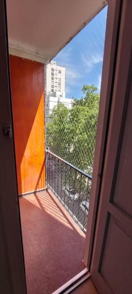 una puerta abierta a un balcón con vistas en Depto mardel cómodo luminoso cerca de todo en Mar del Plata