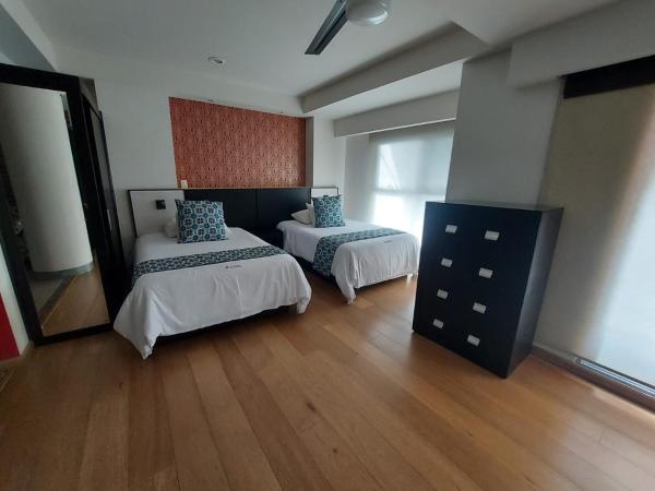 Cama o camas de una habitación en Capital Luxury Apartments & Offices