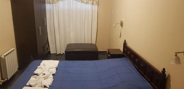 Una cama o camas en una habitación de Nuevo Hotel Magnet