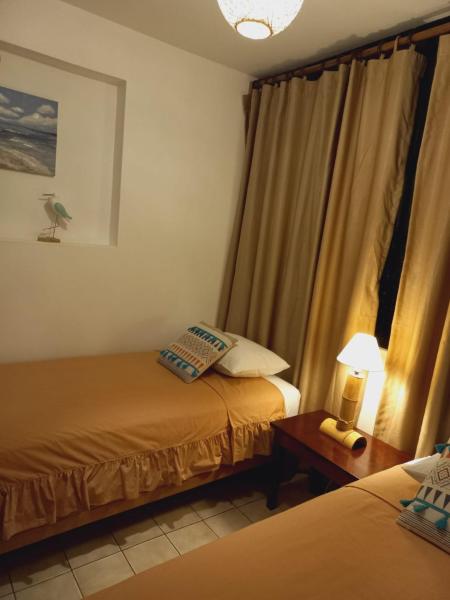 Cama o camas de una habitación en Casa Blanca Beach House - Punta Hermosa - Perú